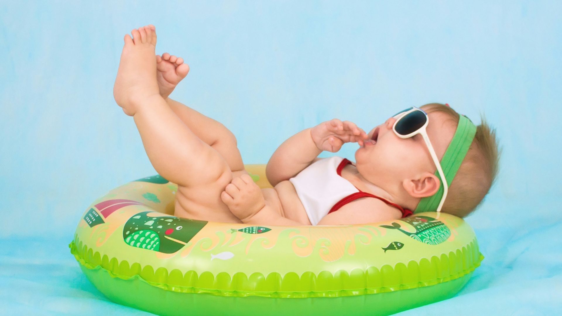 baby lying on inflatable ring