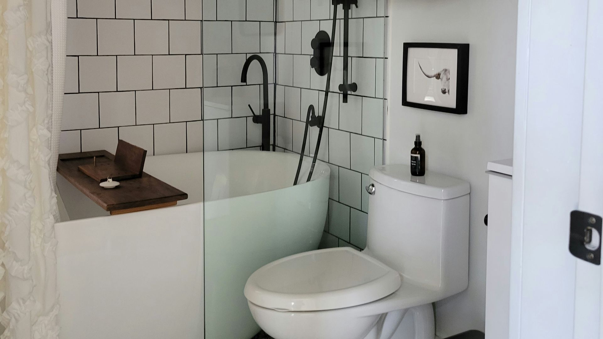 a bathroom with a toilet and bathtub