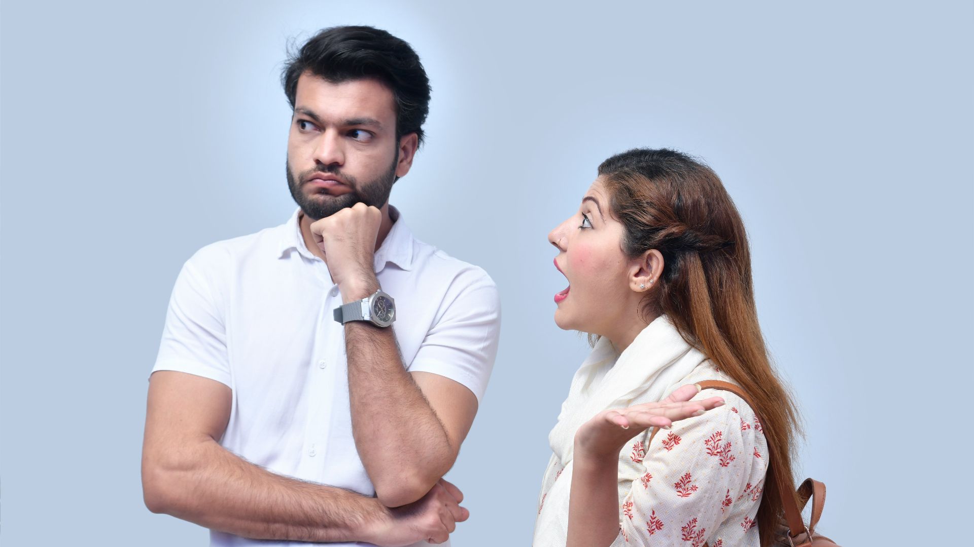 a man and woman looking at each other