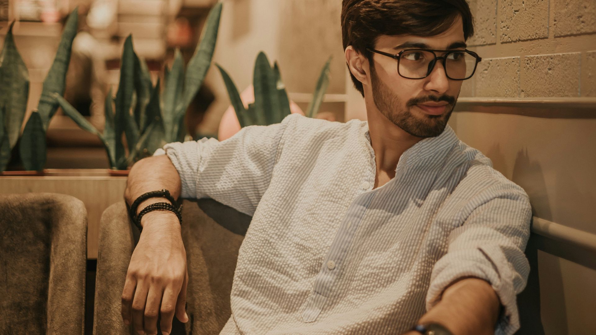 a man sitting at a table in a restaurant