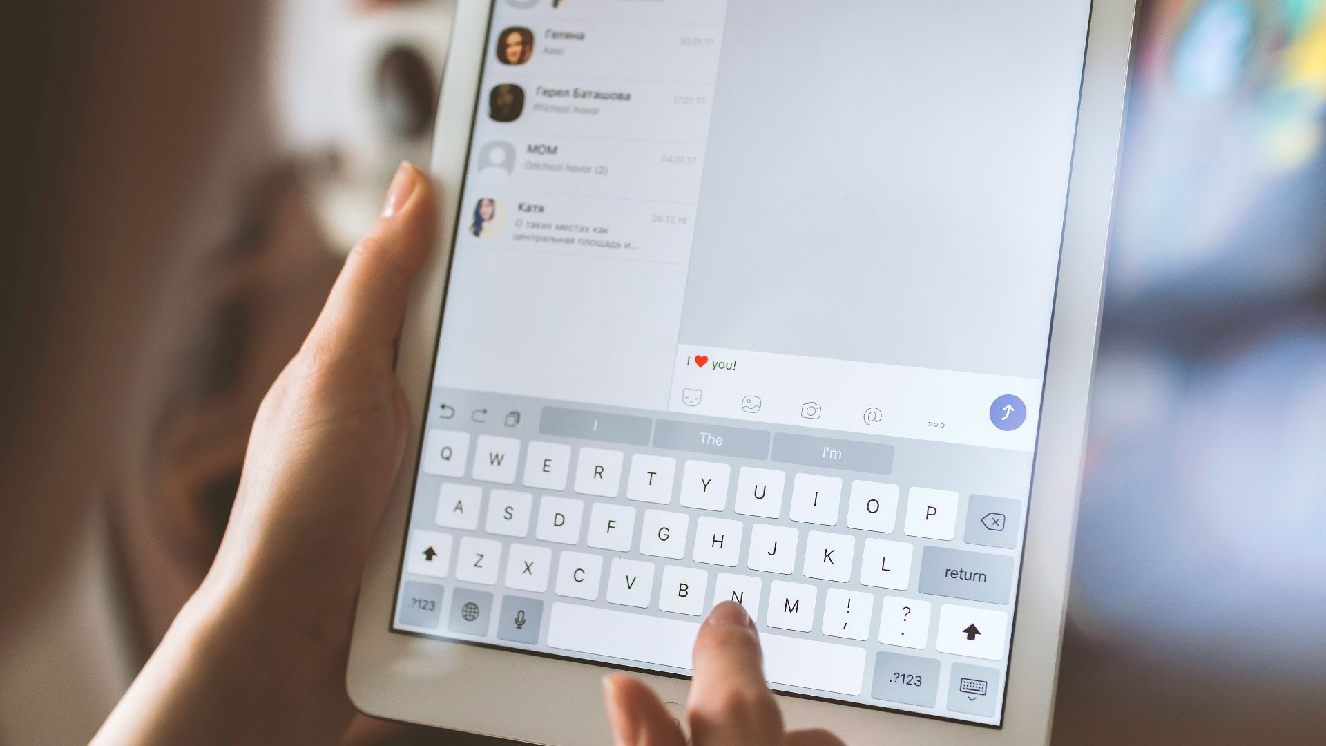 person using white iPad