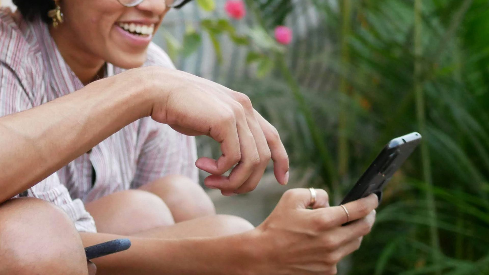 man in black polo shirt sitting beside woman in purple shirt