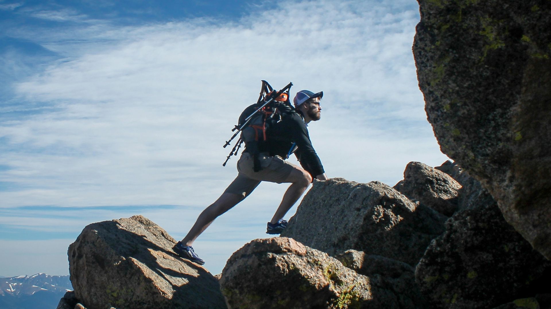 photo of man climbing mountain