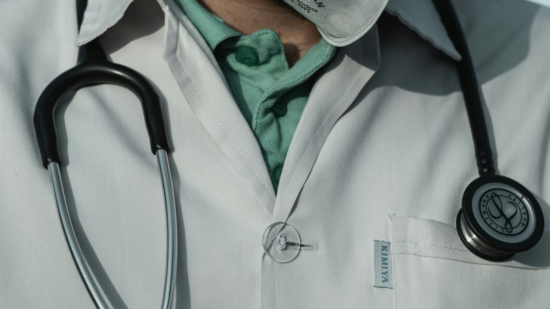 person in white and black stethoscope