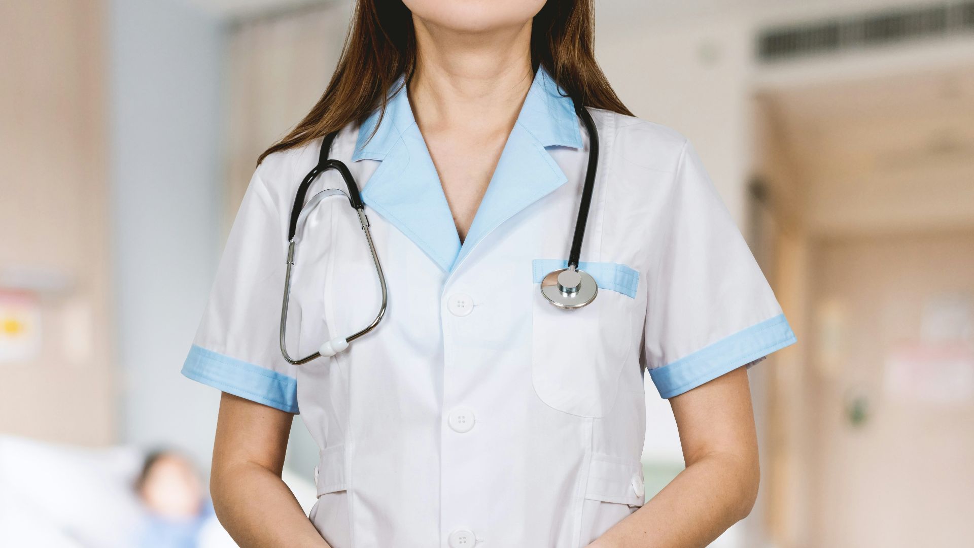 woman in white button up shirt and blue stethoscope