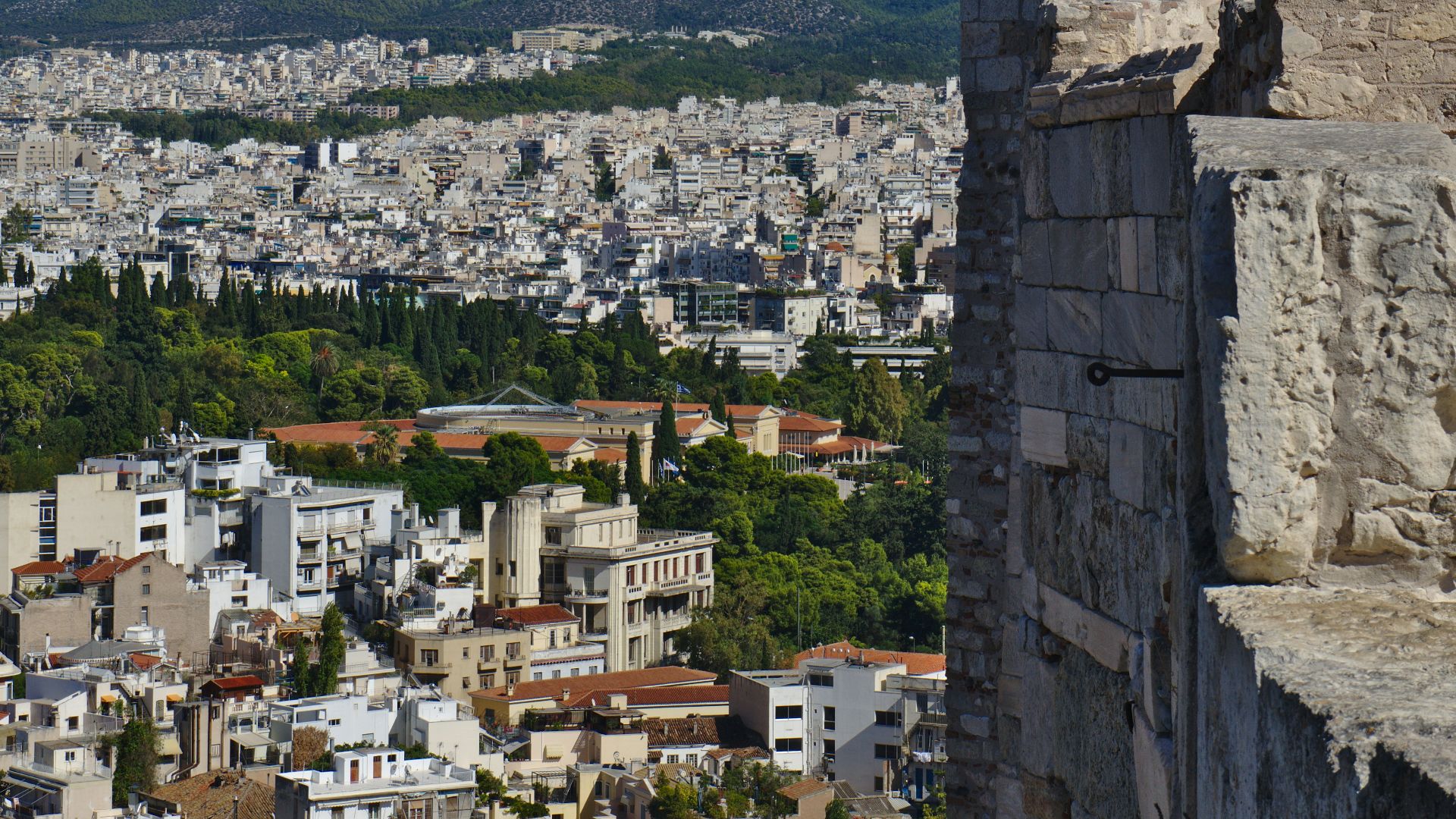 a group of people standing on top of a tall building