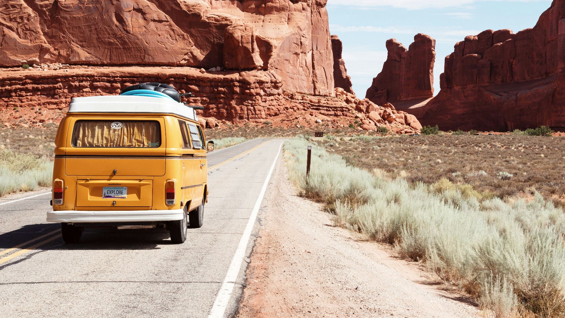 yellow Volkswagen van on road