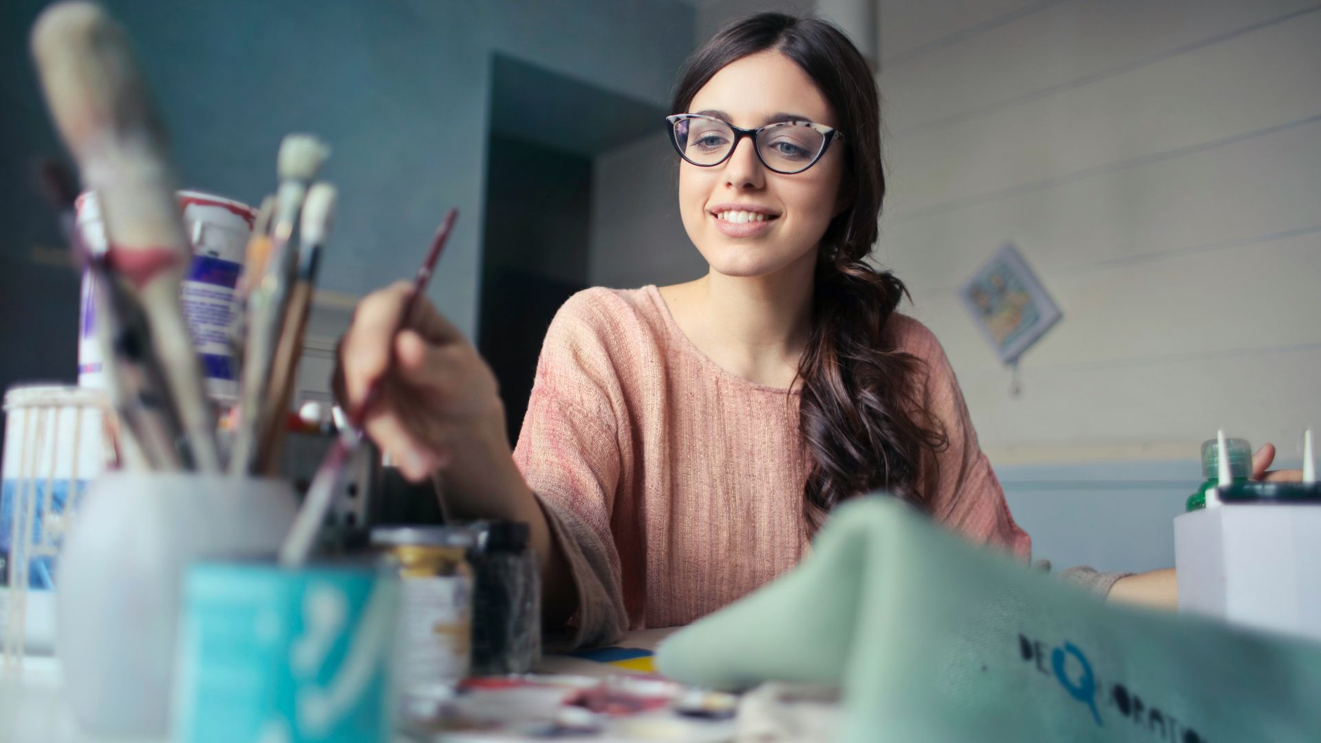woman holding paint brush