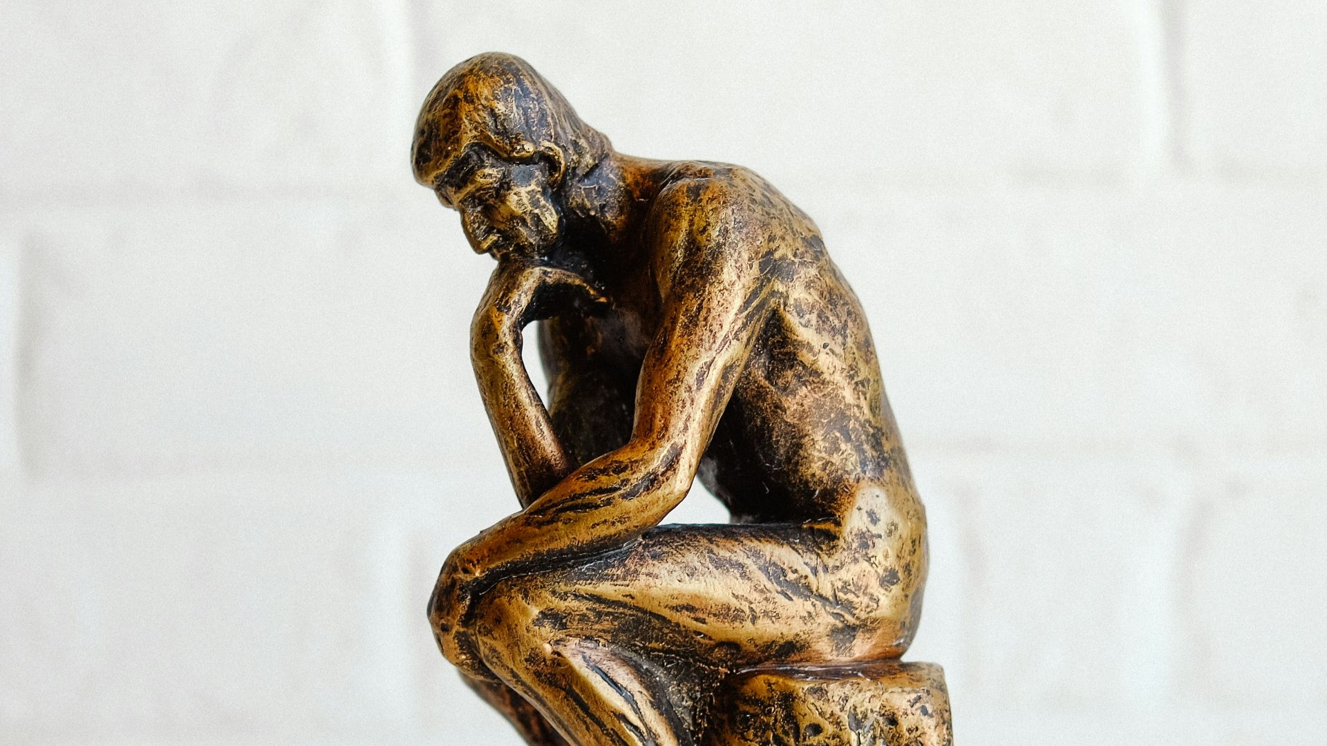 brown concrete statue of man