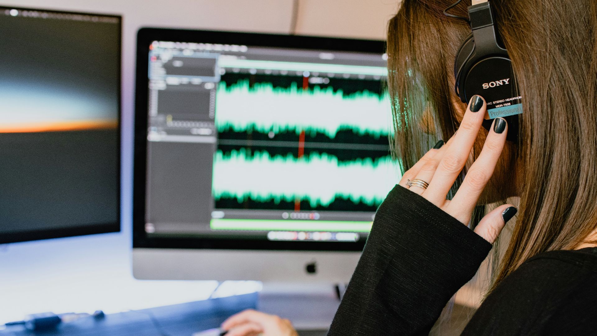 woman in black long sleeve shirt using black laptop computer