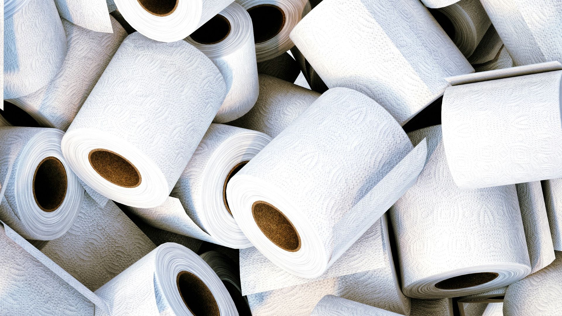 a pile of white toilet paper sitting next to each other