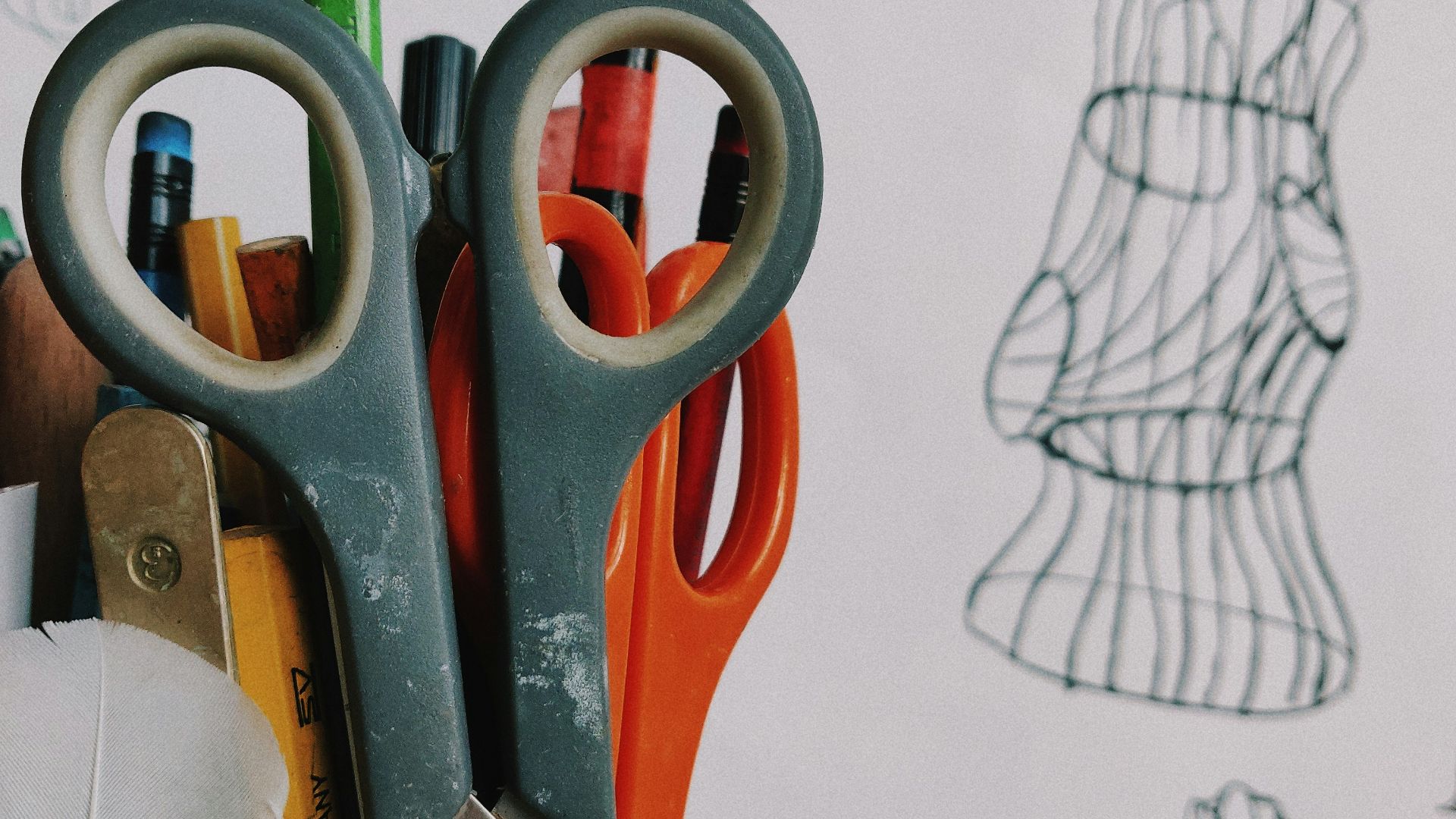 pen and scissors in vase