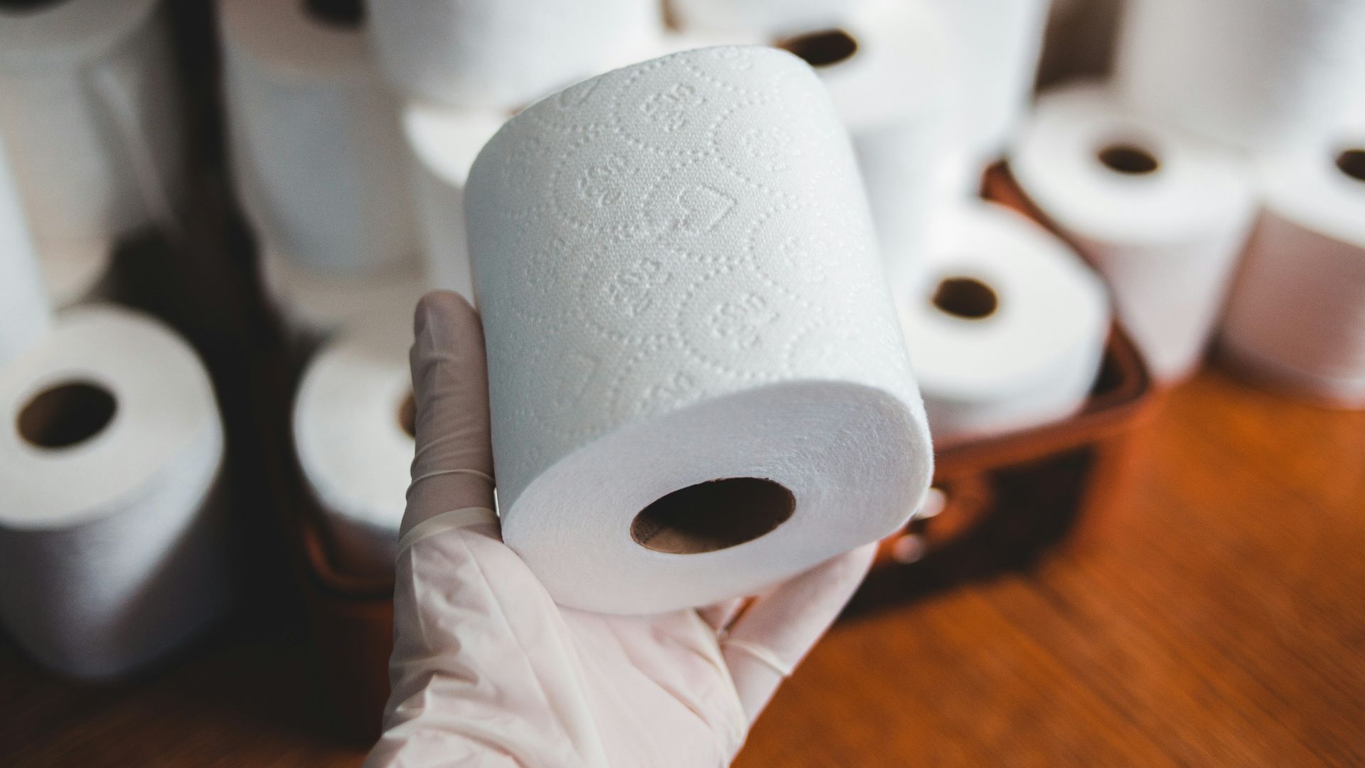 white tissue paper roll on brown wooden table