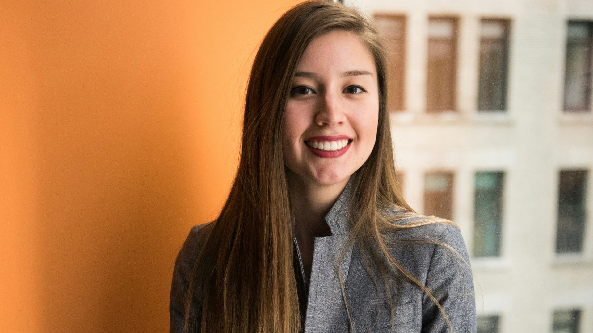 shallow focus photo of woman in gray jacket