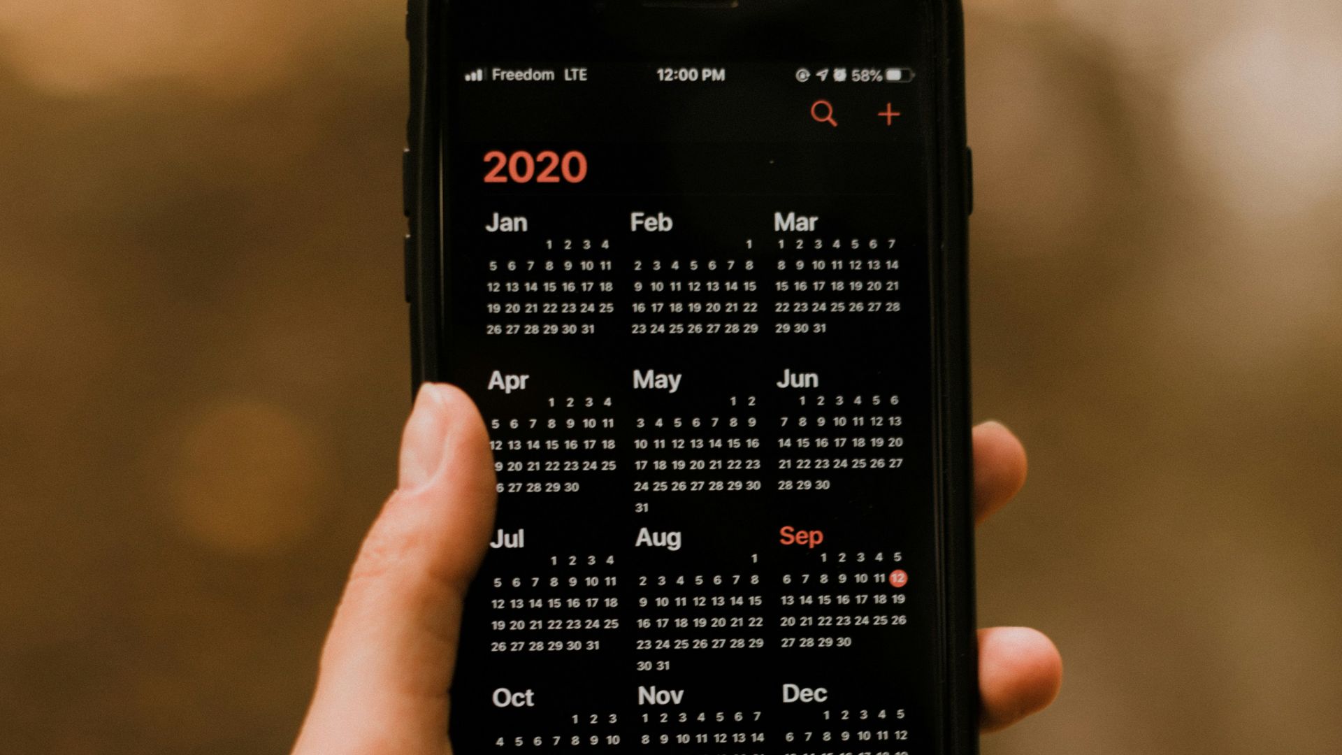 person holding black android smartphone