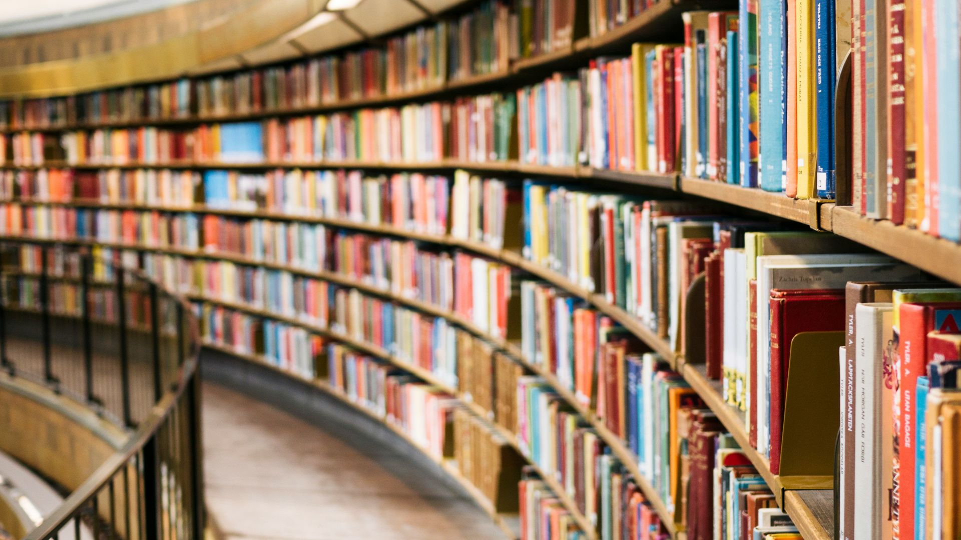 books on brown wooden shelf