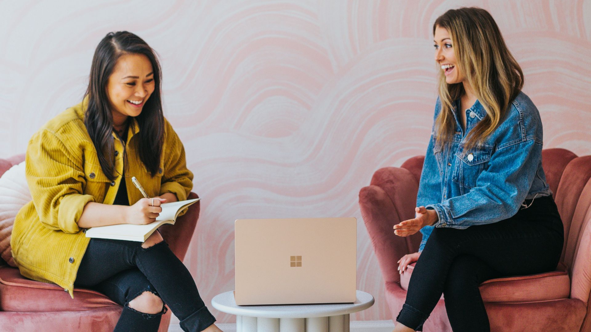 3 women sitting on chair
