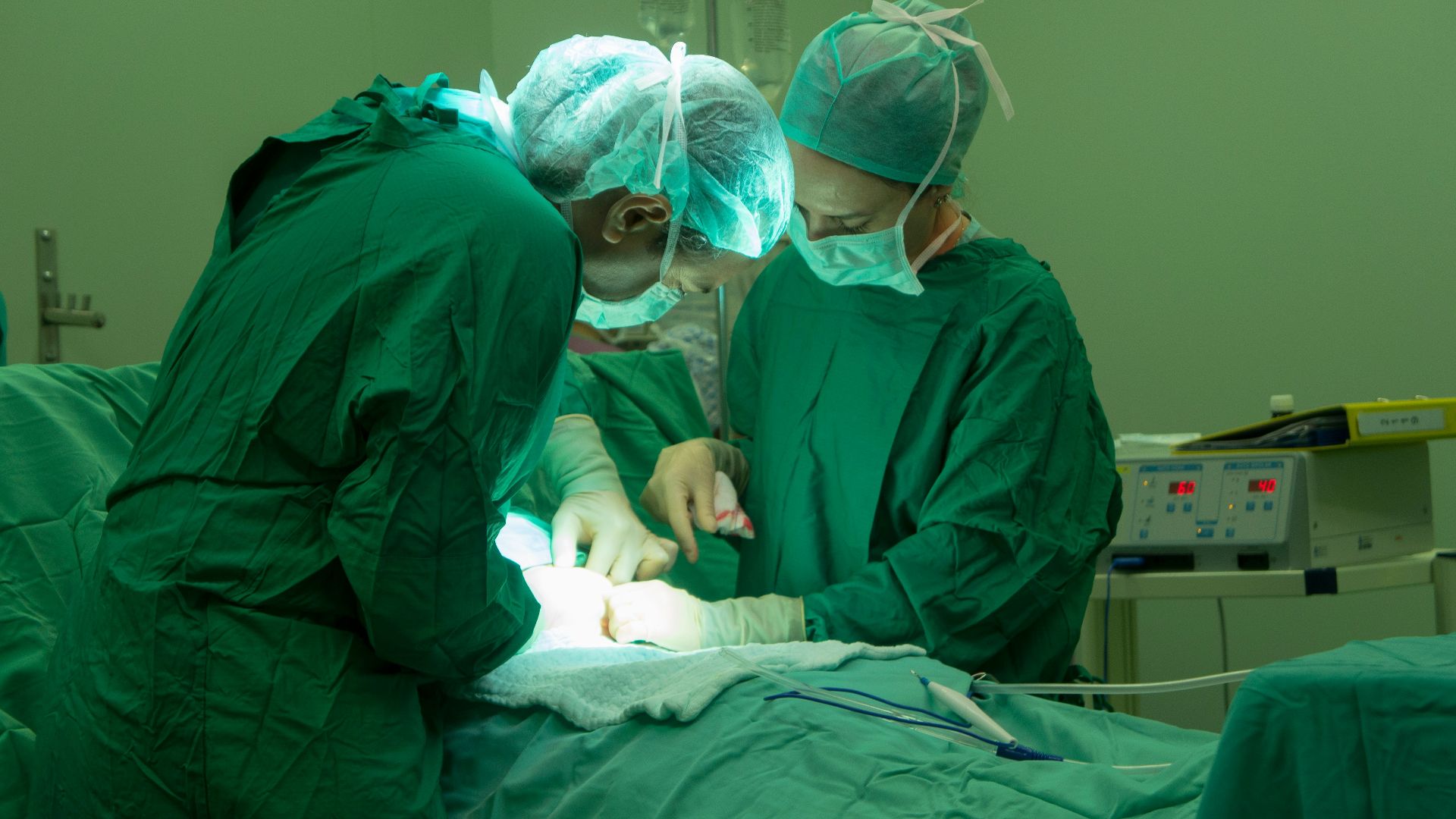 a group of doctors performing surgery on a patient