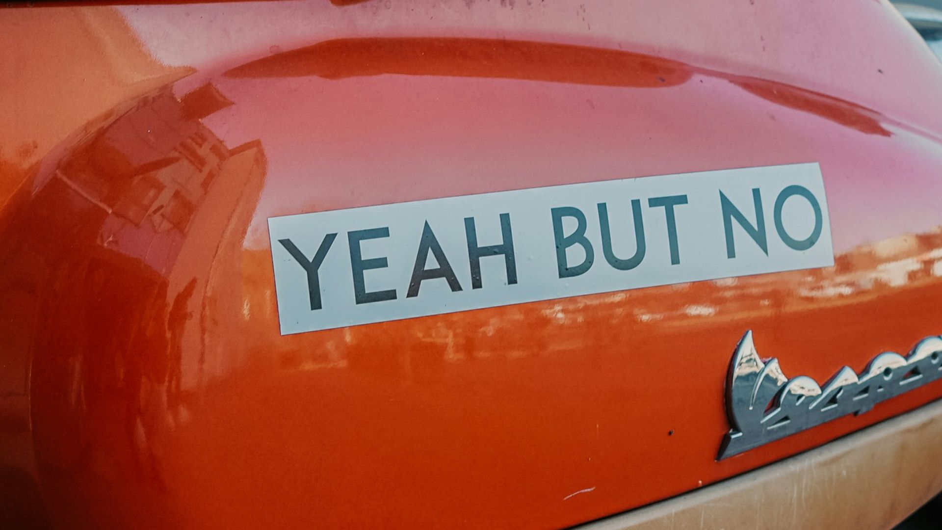 close-up photography of red motor scooter