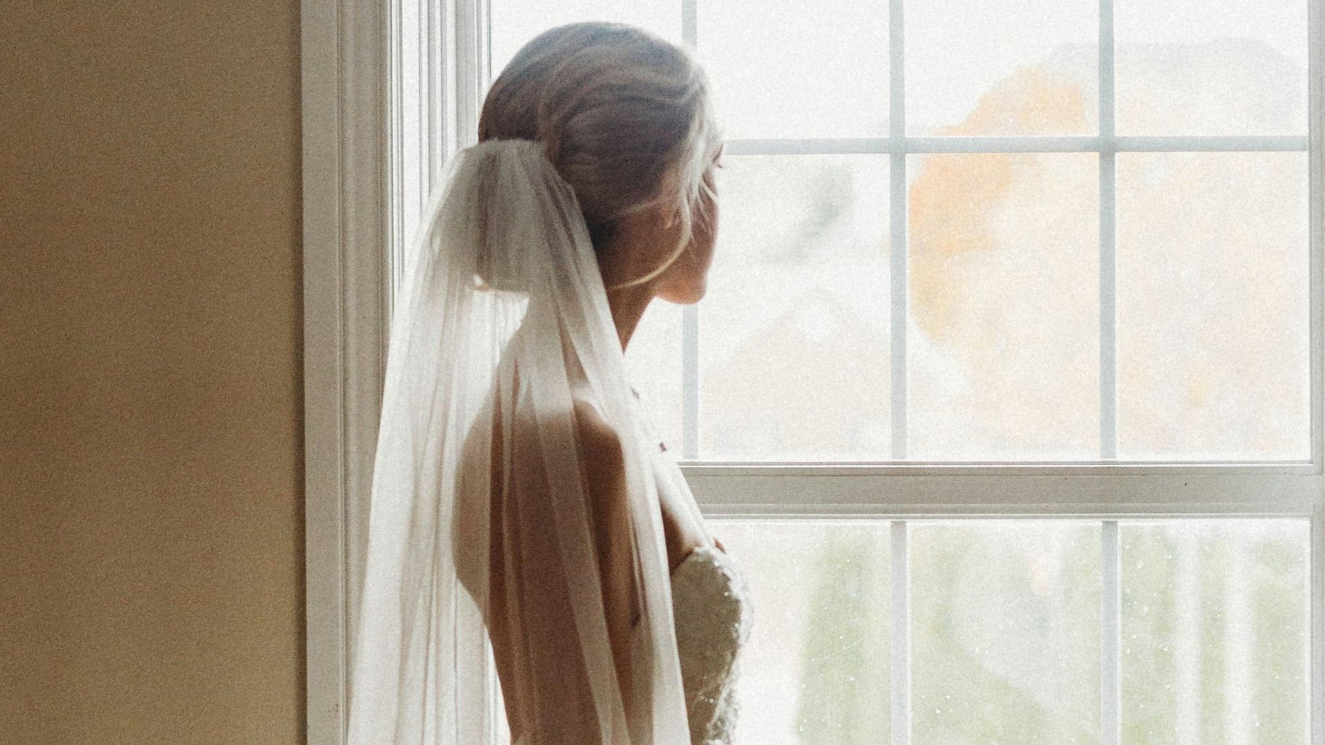 white sheer window curtain on window