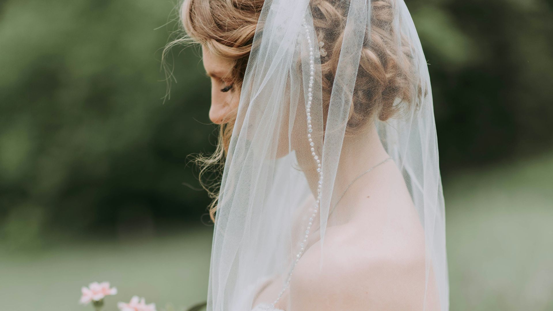 woman wearing white wedding dress with veil