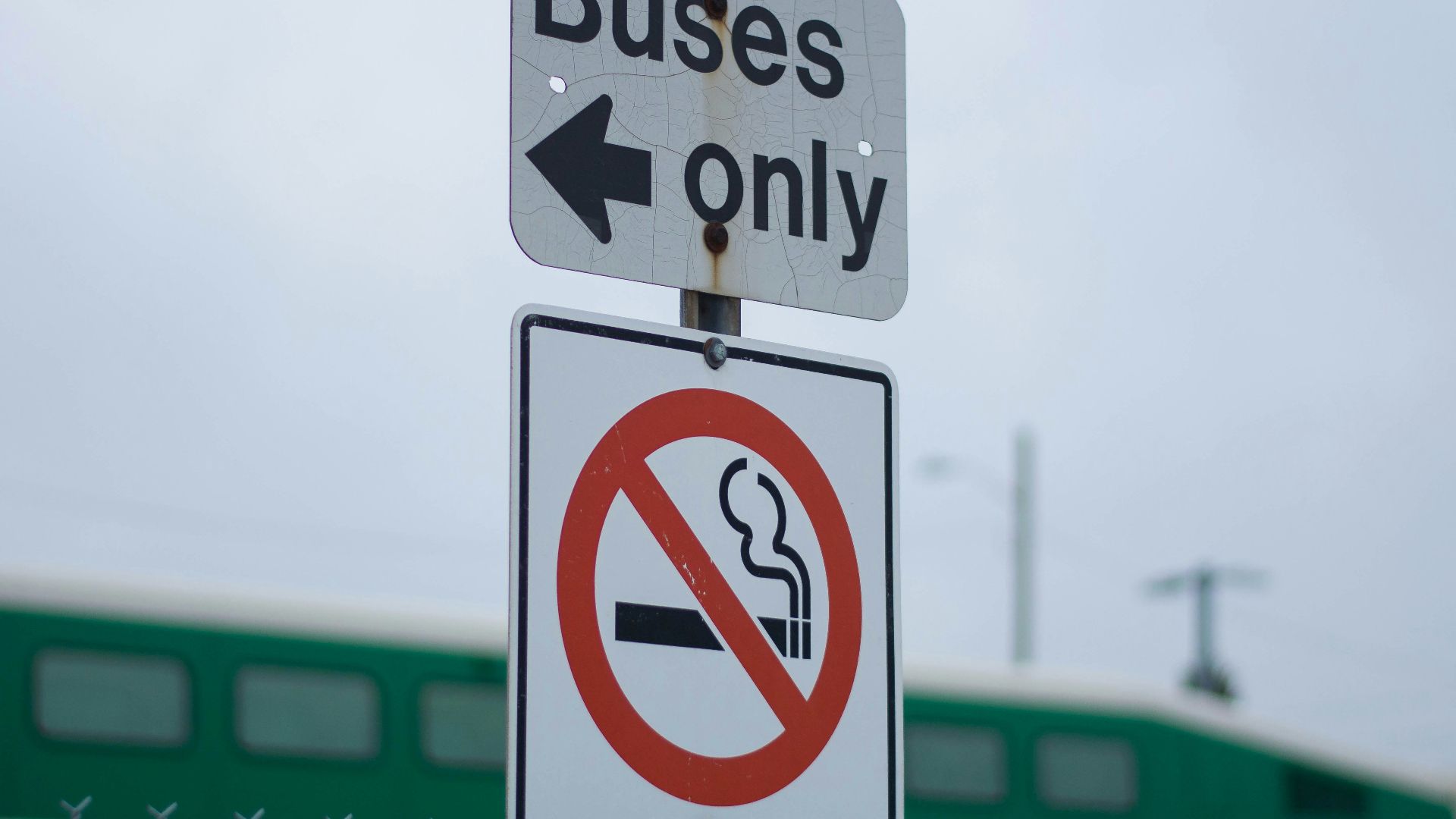 buses only and no smoking sign near train