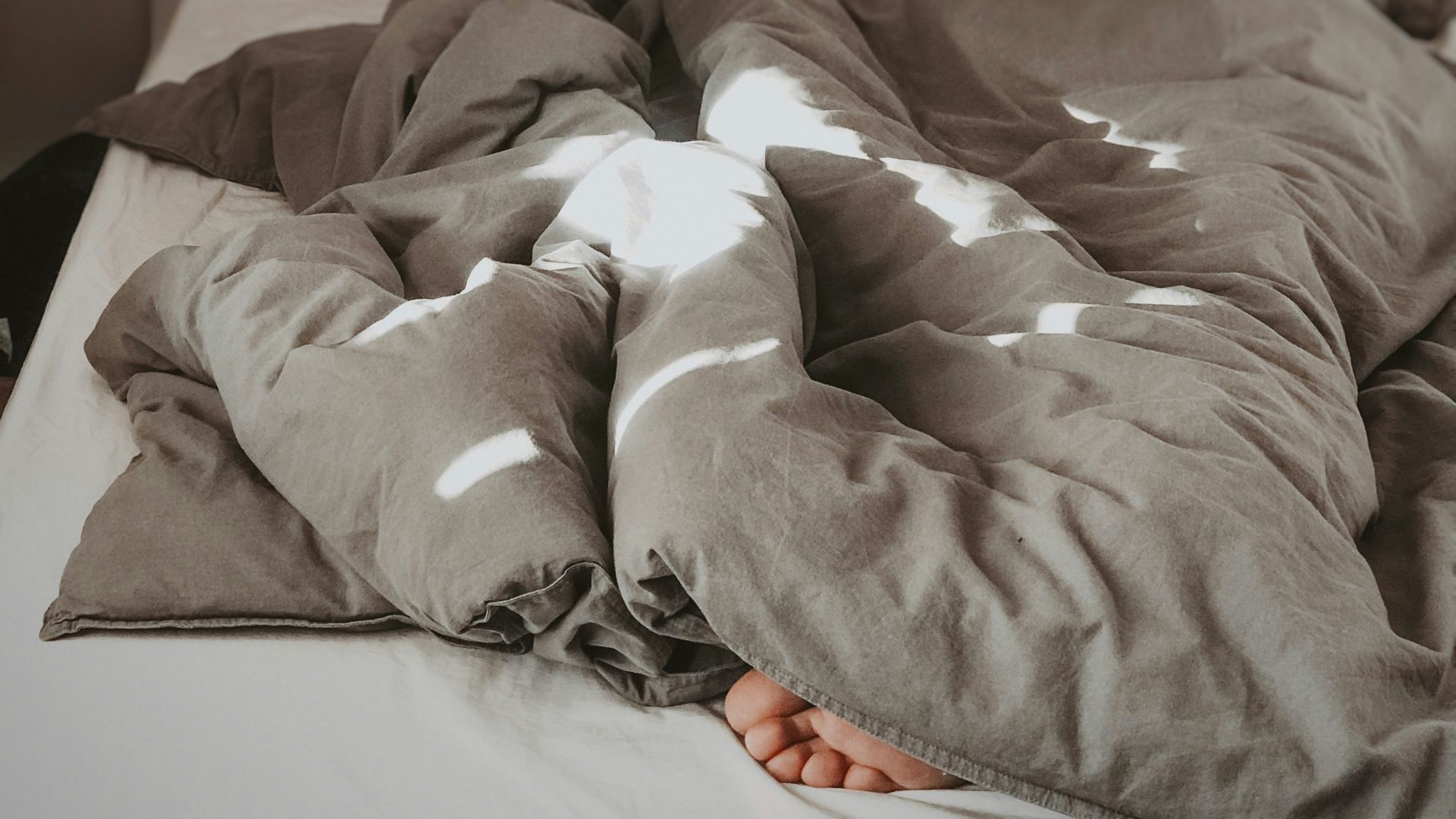 brown and white bed linen