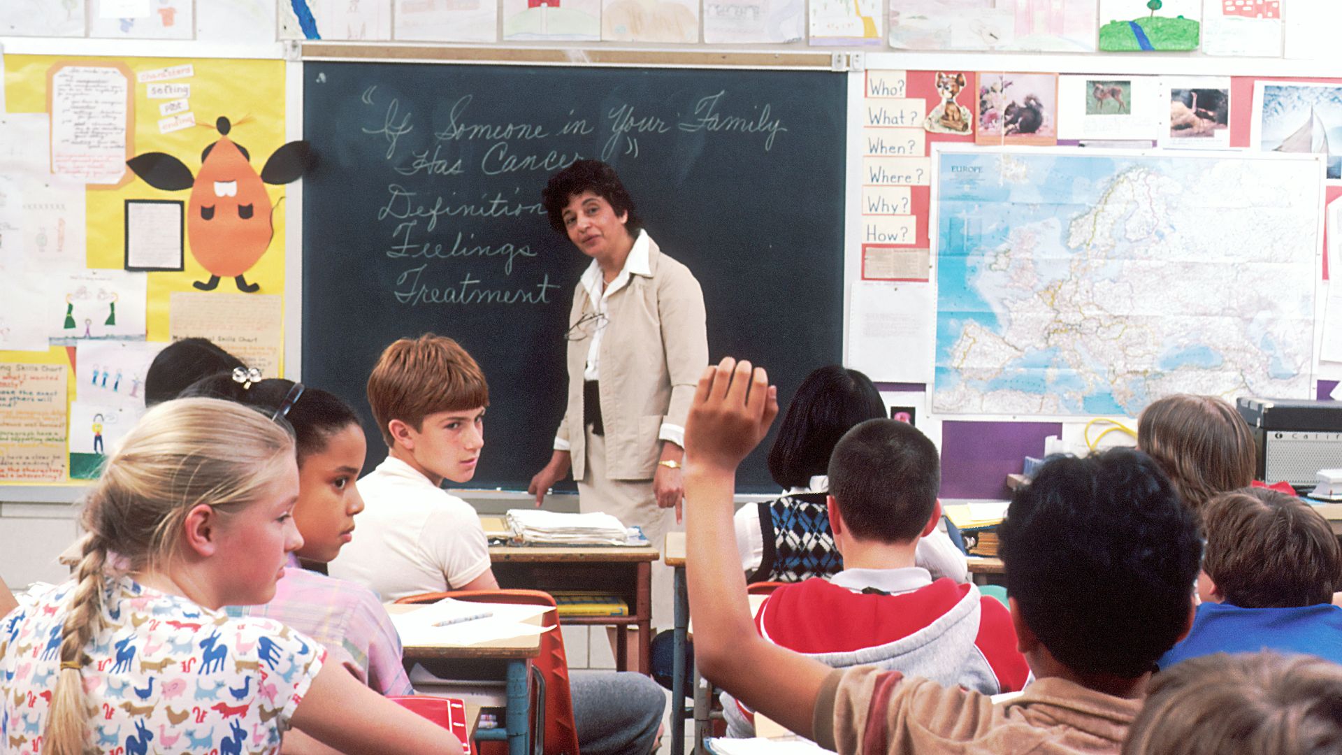 woman standing in front of children