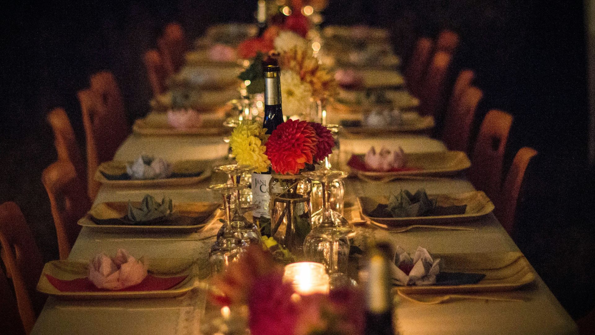 white and green ceramic plates on brown wooden dining table