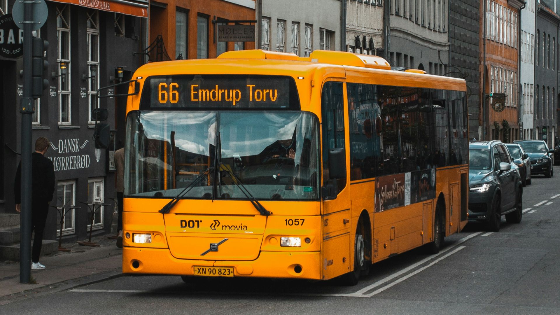 yellow and black bus on road at daytime