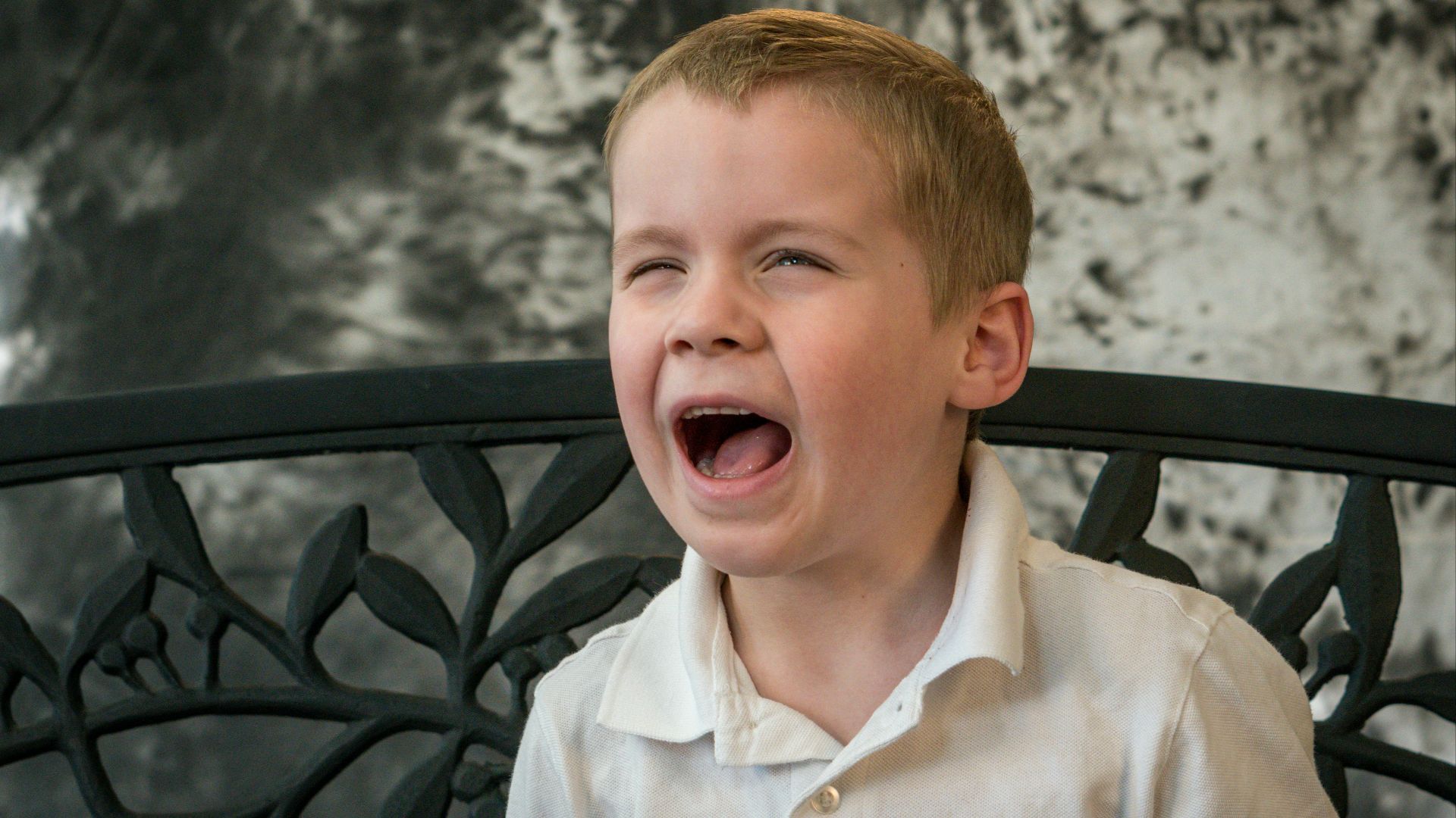 shallow focus photo of boy in white button-up shirt
