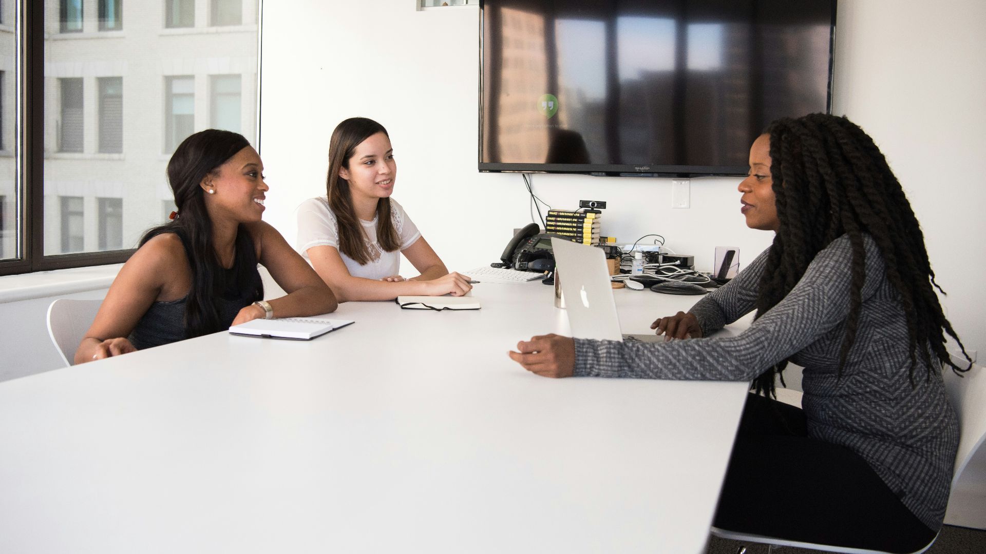 three women sitting at the table