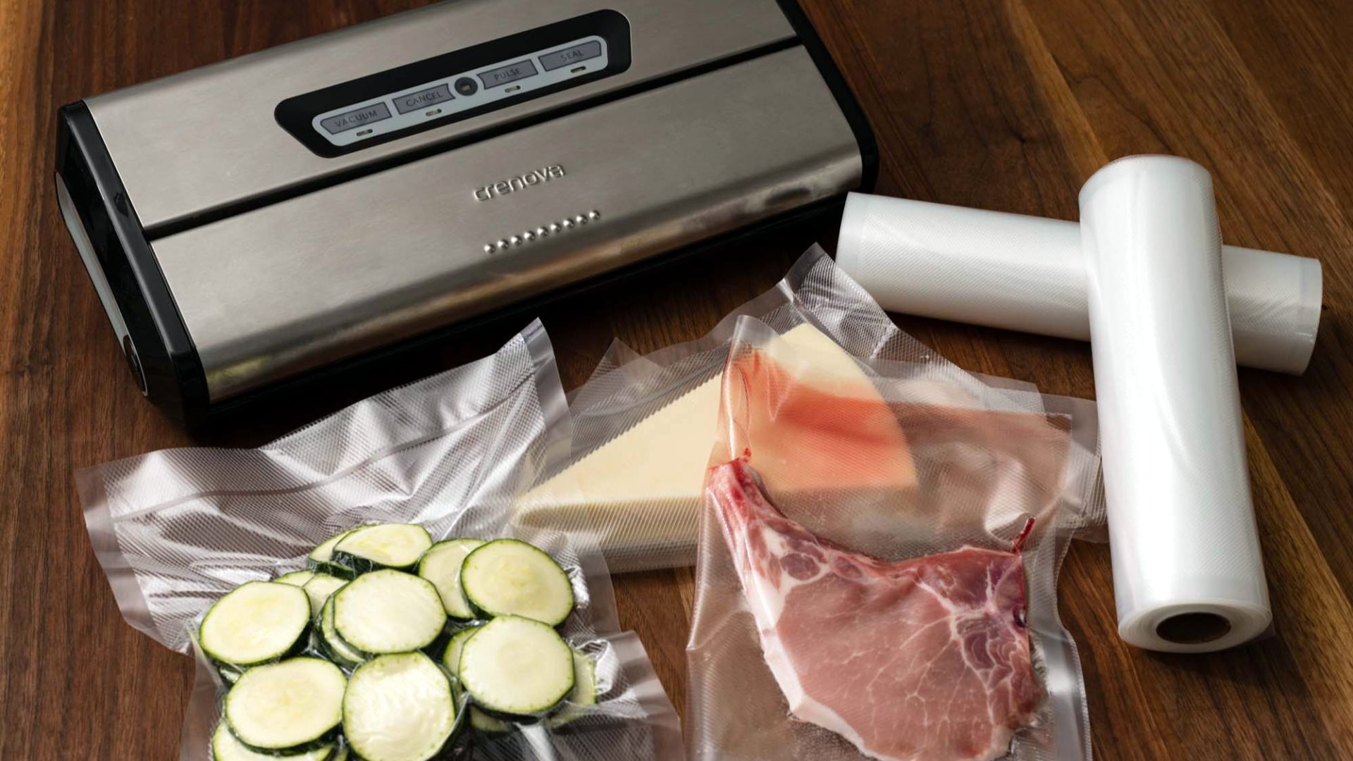 File:Vacuum sealer with food sealed on wooden table and rolls of plastic for sealing.jpg