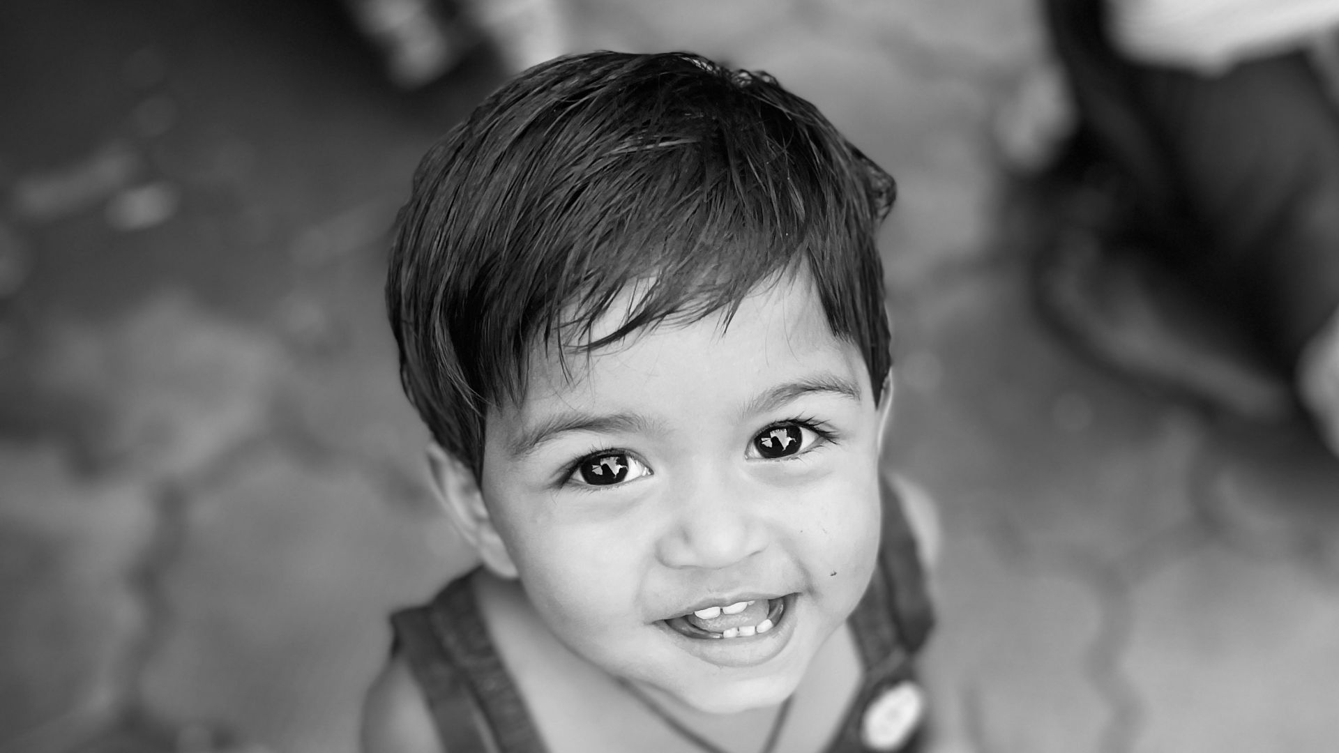 a child smiling at the camera