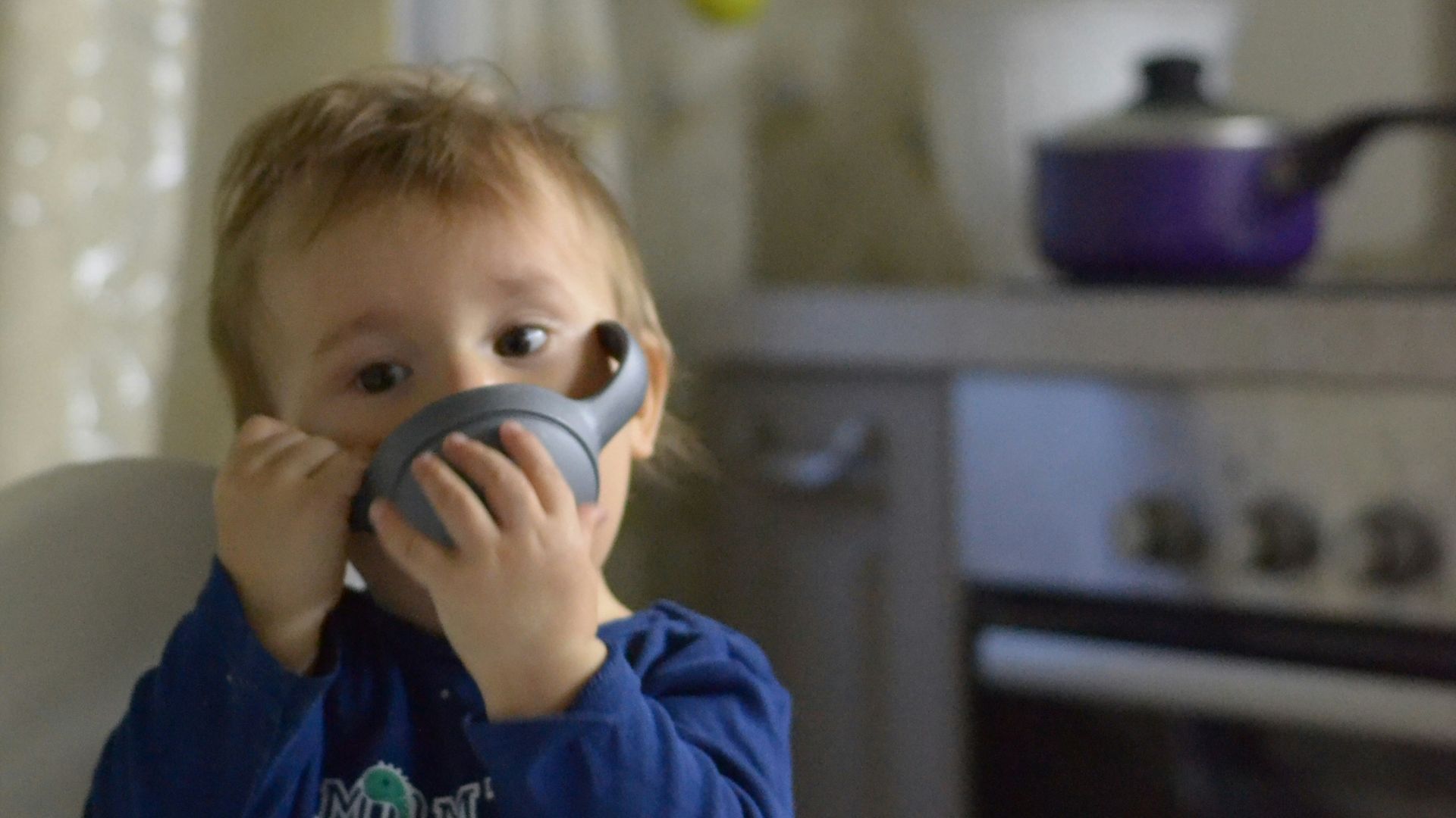 a boy holding a phone