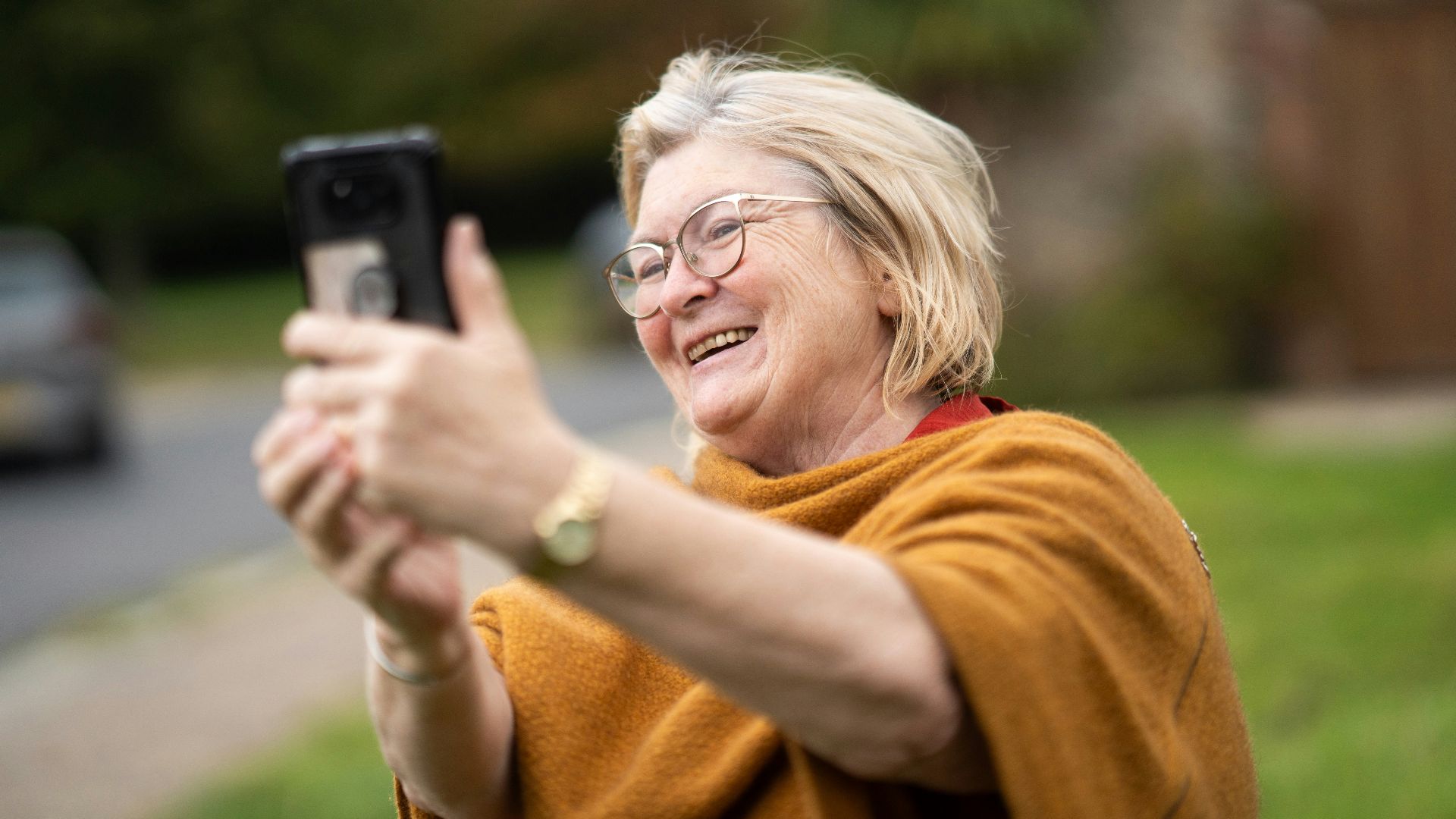a woman taking a picture with her cell phone