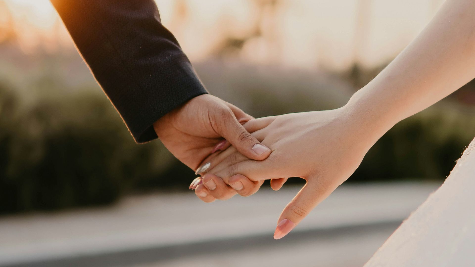 man and woman hands holding