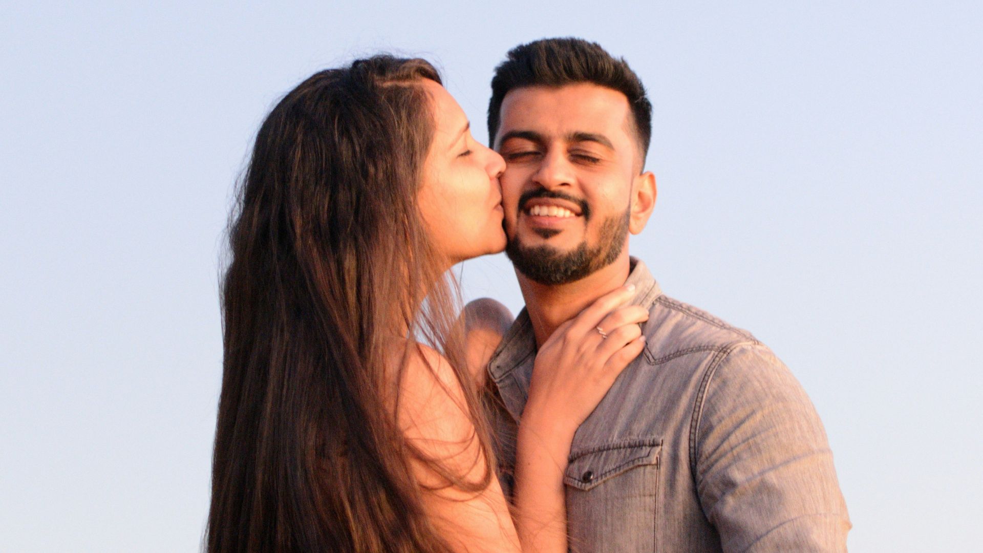 a man and woman kissing