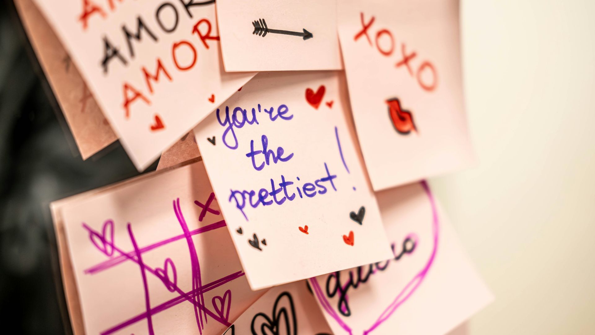 A bunch of post it notes with writing on them