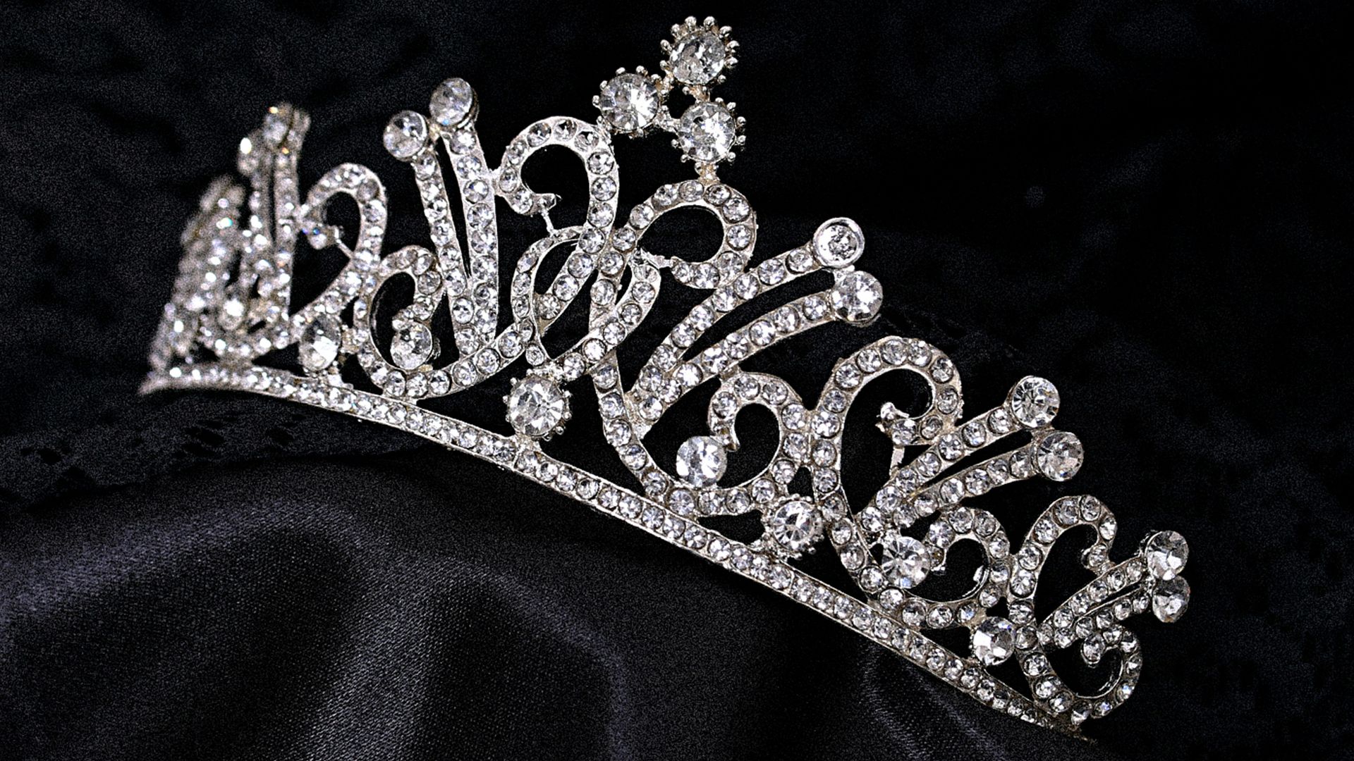 a tiara on a black background