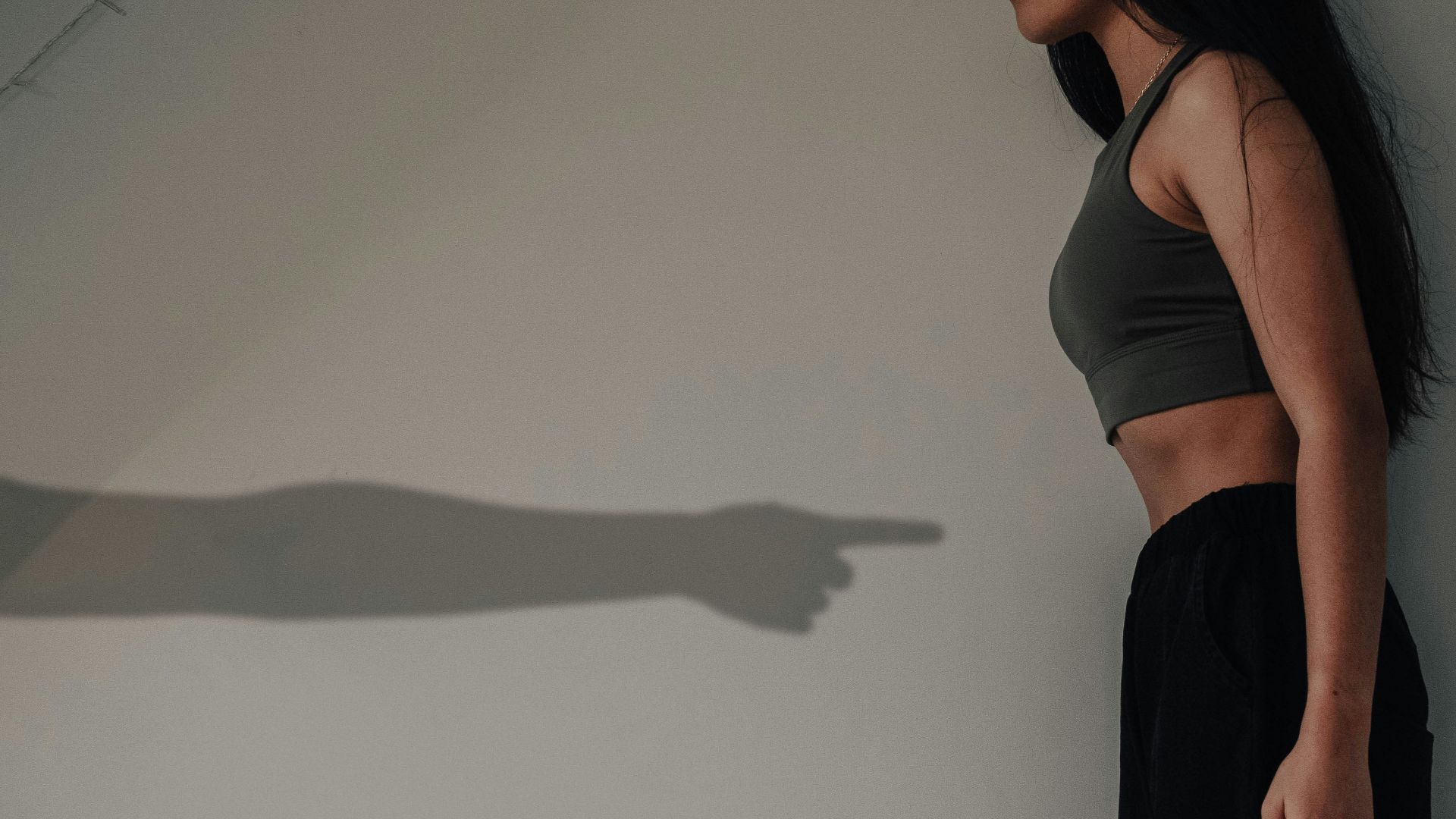 woman in black tank top and black pants