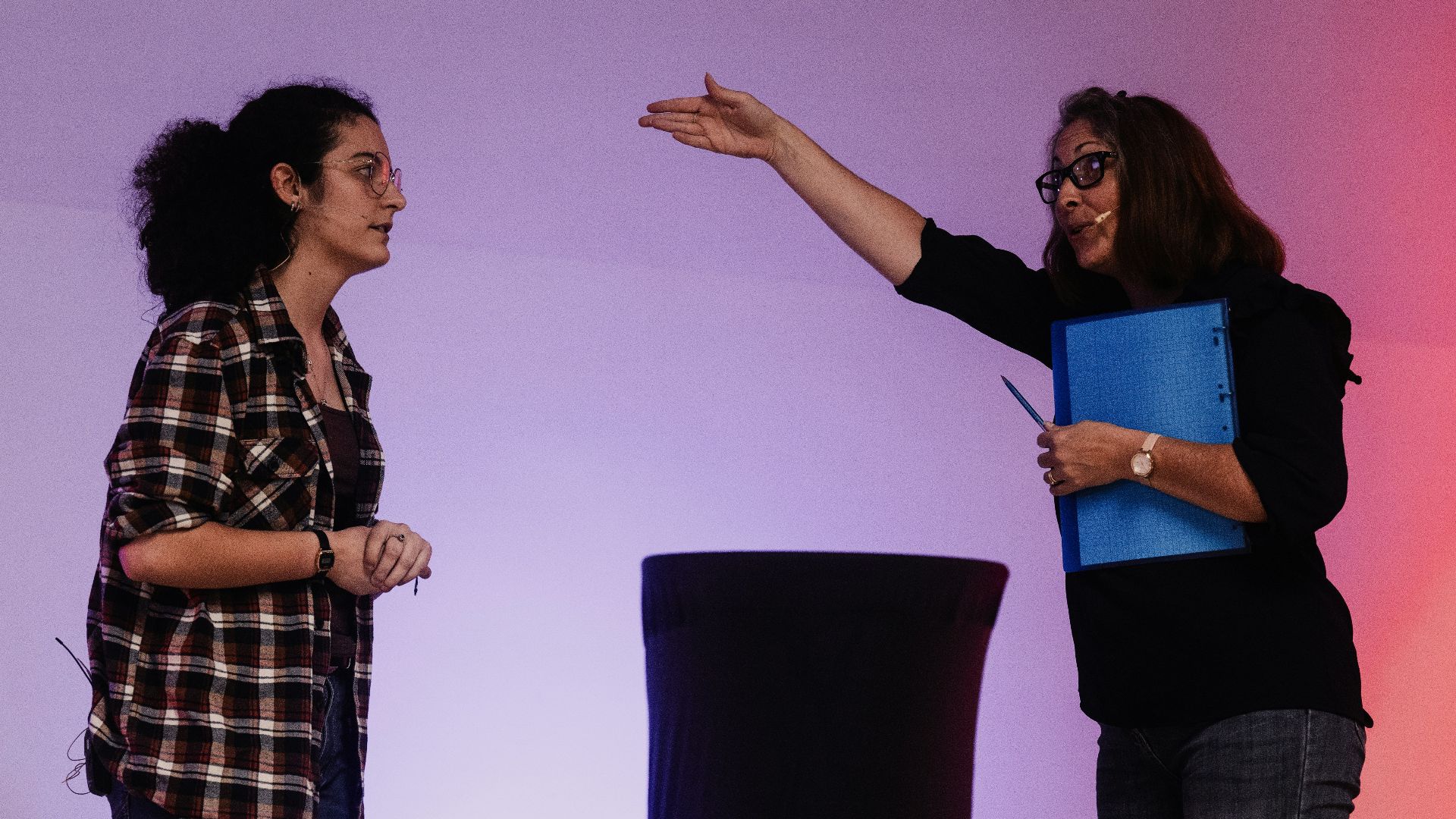 A couple of women standing next to each other