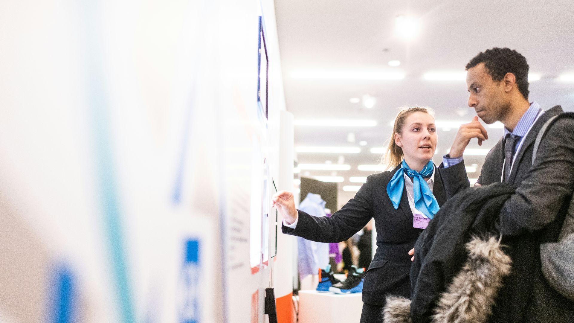 man and woman talking near the wall