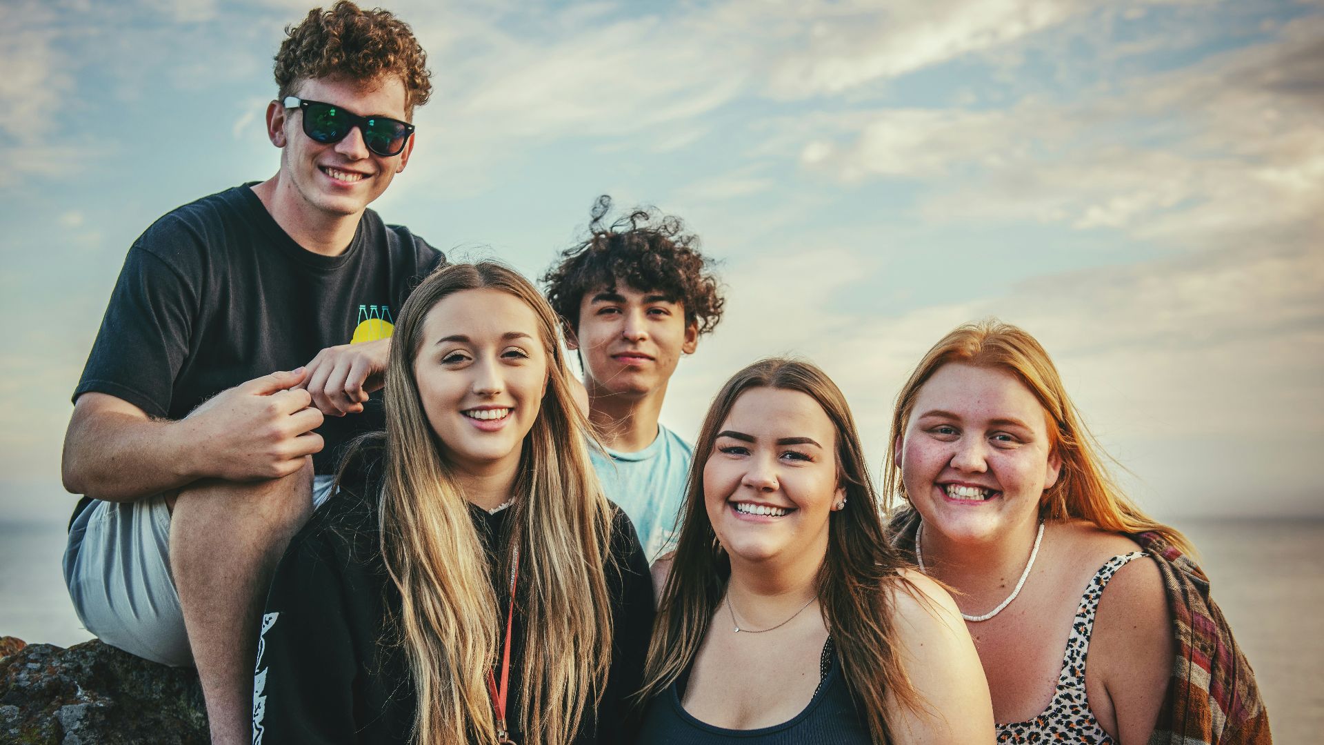 photography of five people near outdoor during daytime