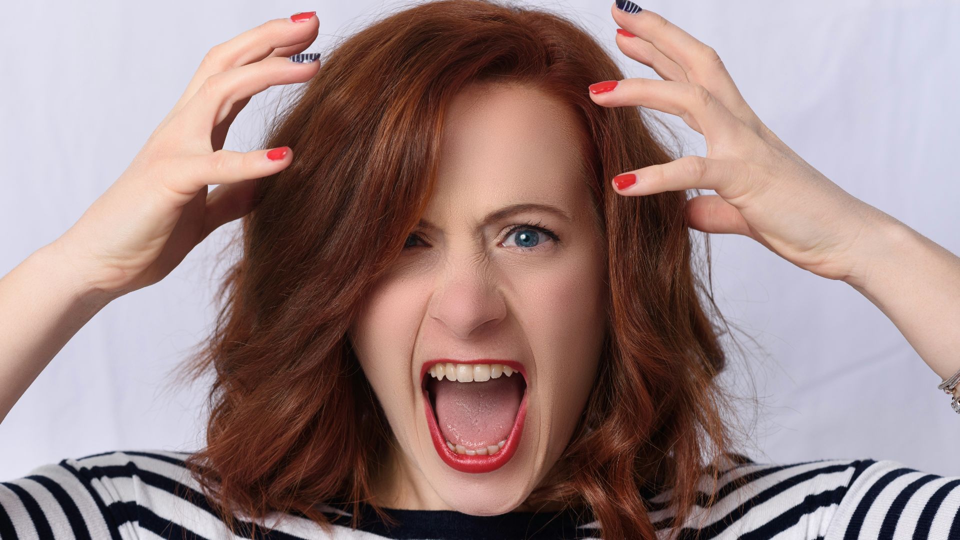 smiling girl in black and white striped shirt