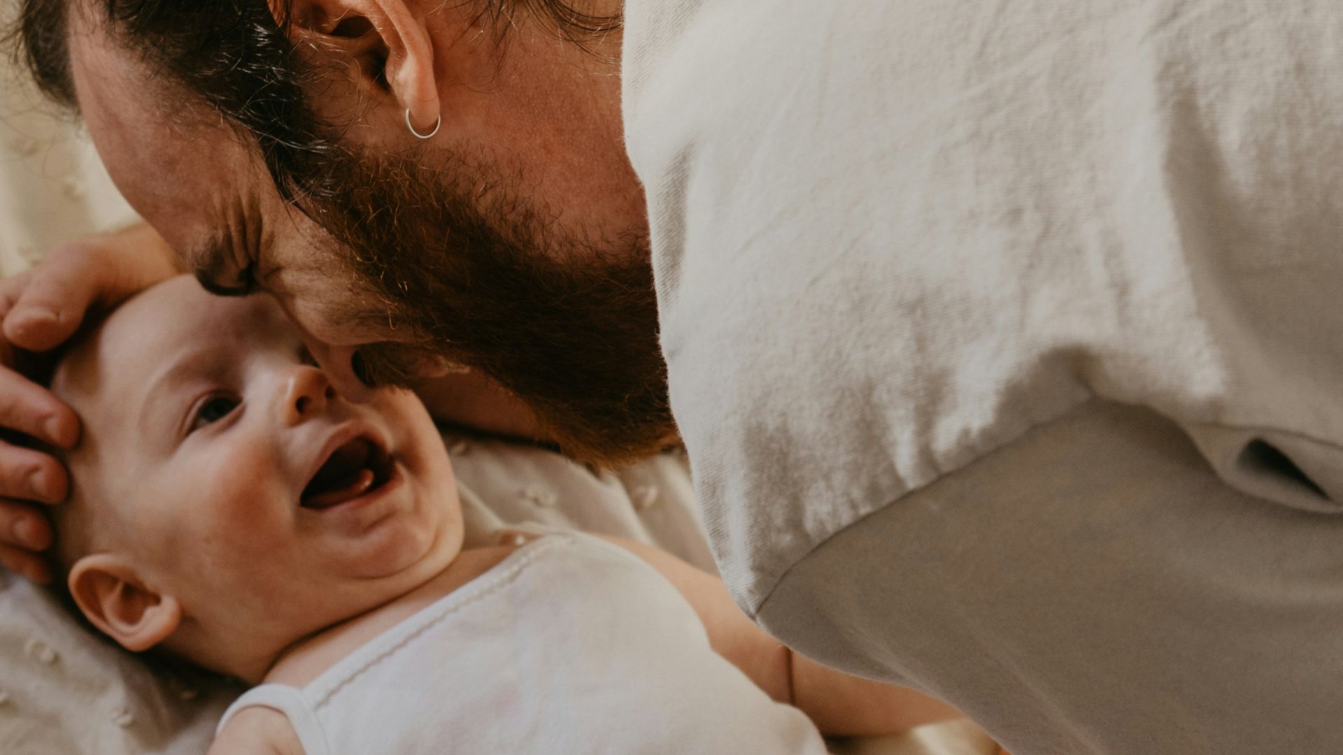 a man holding a baby