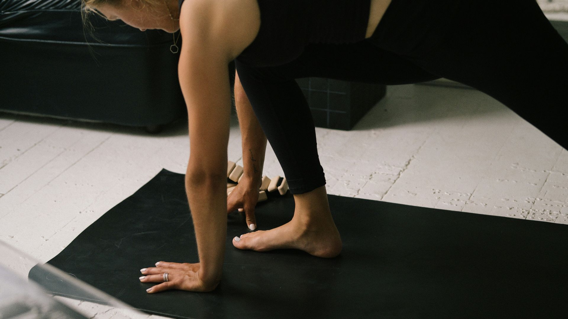 a pair of feet on a black surface