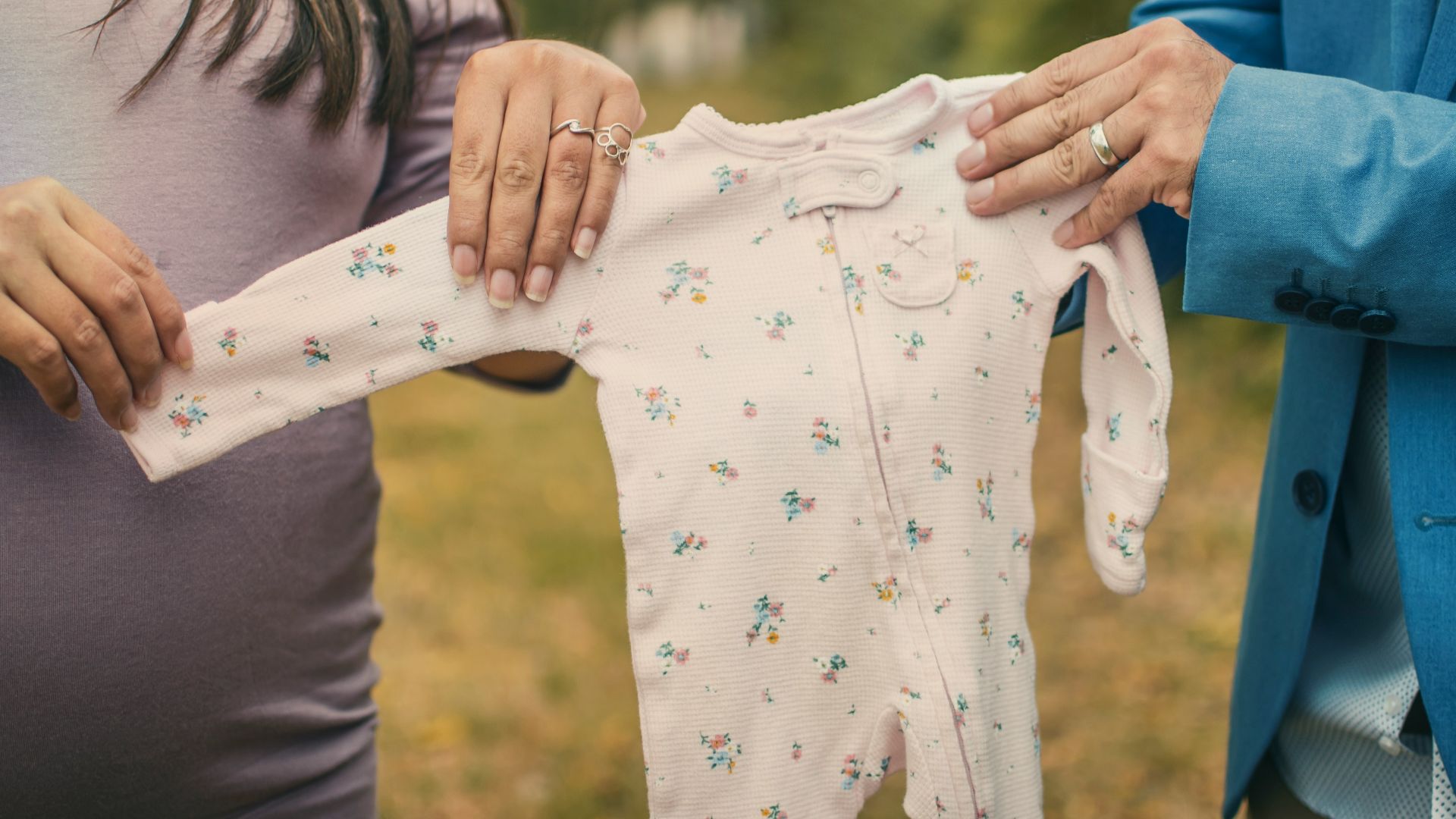 woman in white and blue long sleeve shirt holding blue and white star print textile
