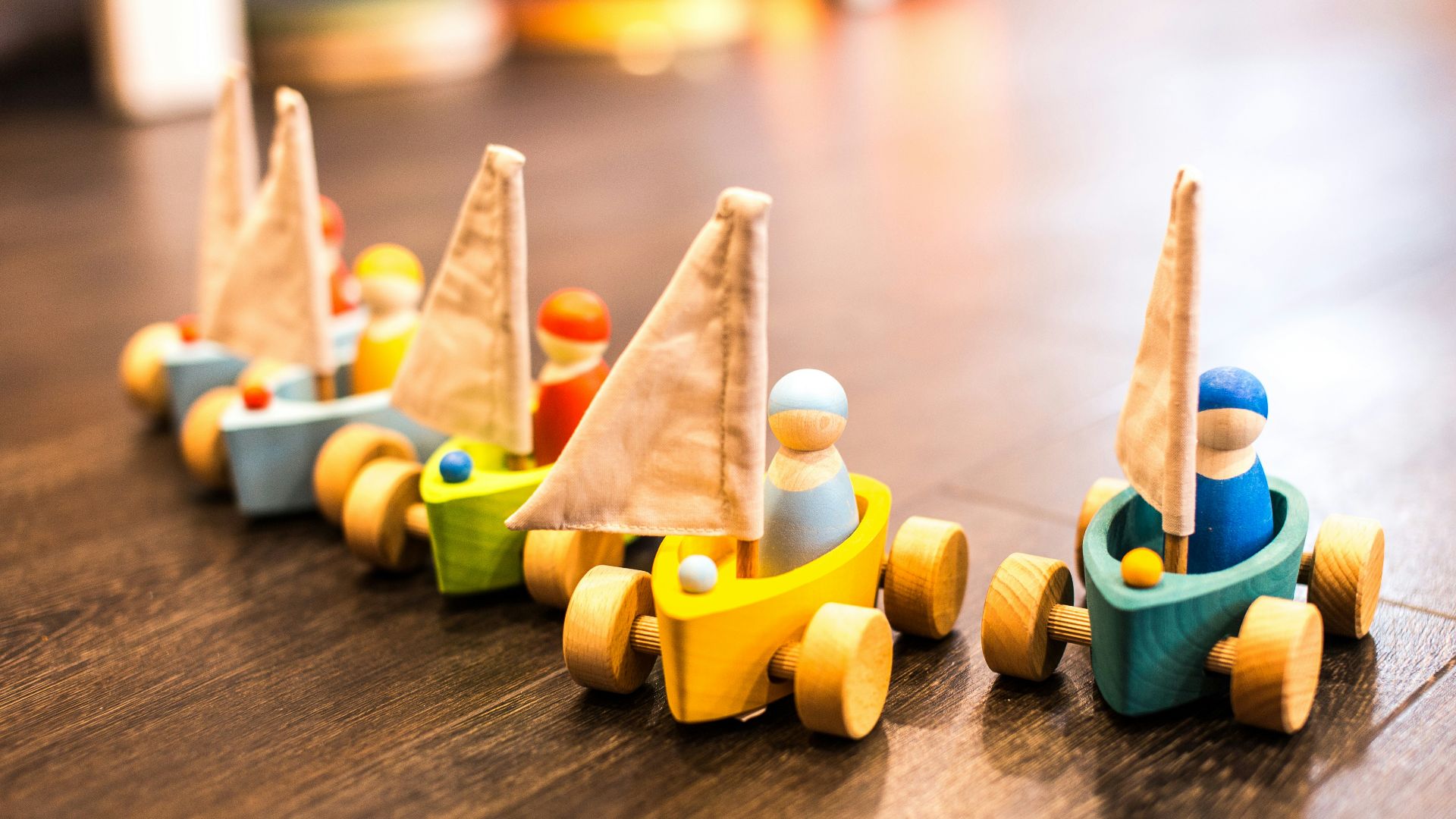 five assorted-color racing car toys