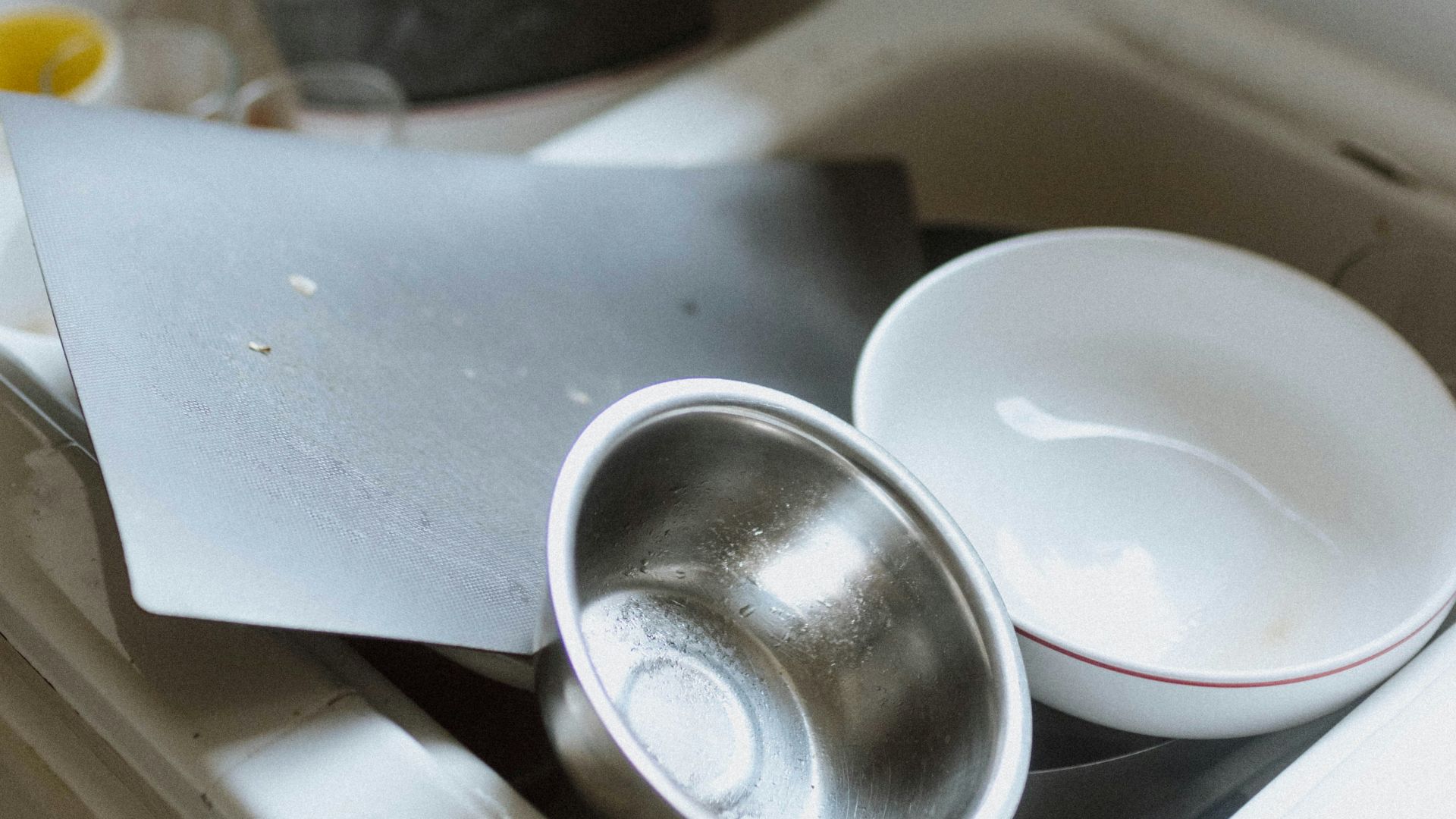 a sink with a couple of dishes on it
